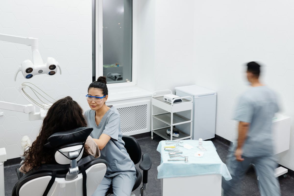 Dentist consulting a patient at a dental clinic in Shrigonda